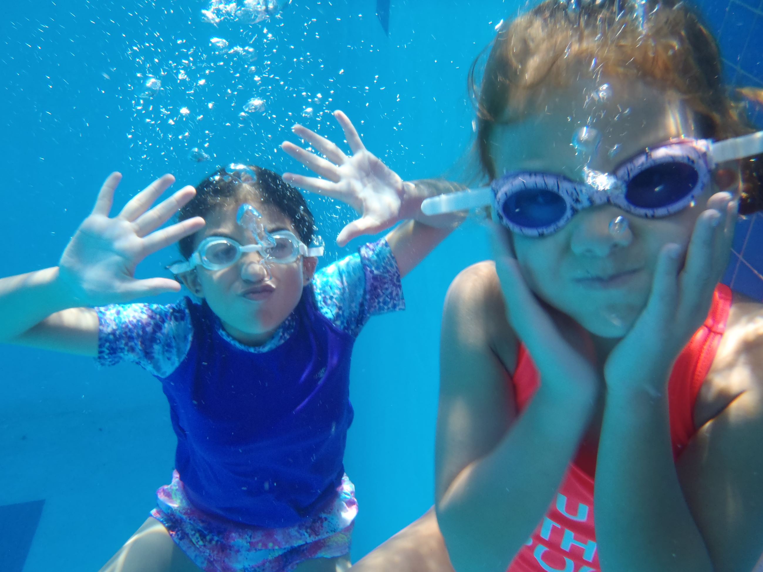 Two girls underwater